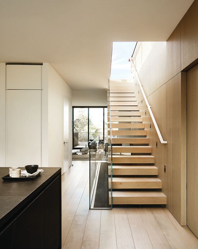 The stairs serve as the homeâs vertical spine on four levels photographed by R. BRAD KNIPSTEIN PHOTOGRAPHY