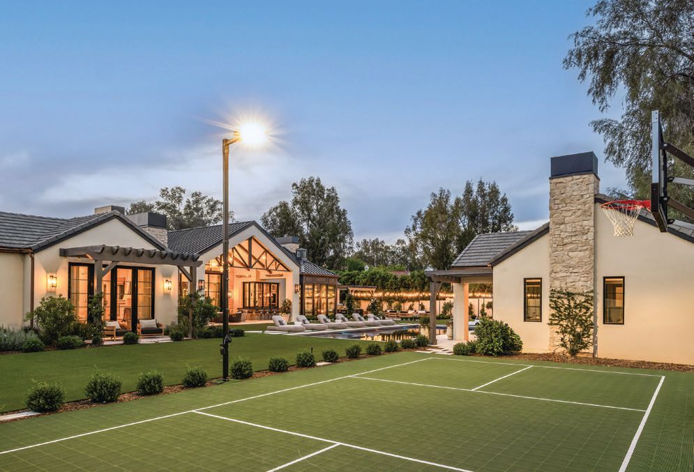 The property sits on over an acre and houses a fabulous sports court with bocce ball and more. Photographed by KEVIN BROST