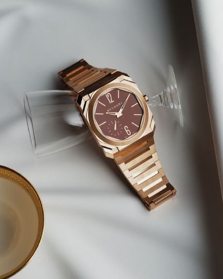 Bvlgari Octo Finissimo Automatic watch featuring mechanical manufacture ultra-thin movement (2.23mm thick), automatic winding, 40mm satinpolished 18K yellow gold case and bracelet, and brown lacquered dial with sunray finishing, bulgari.com. Photographed by JONG HYUP