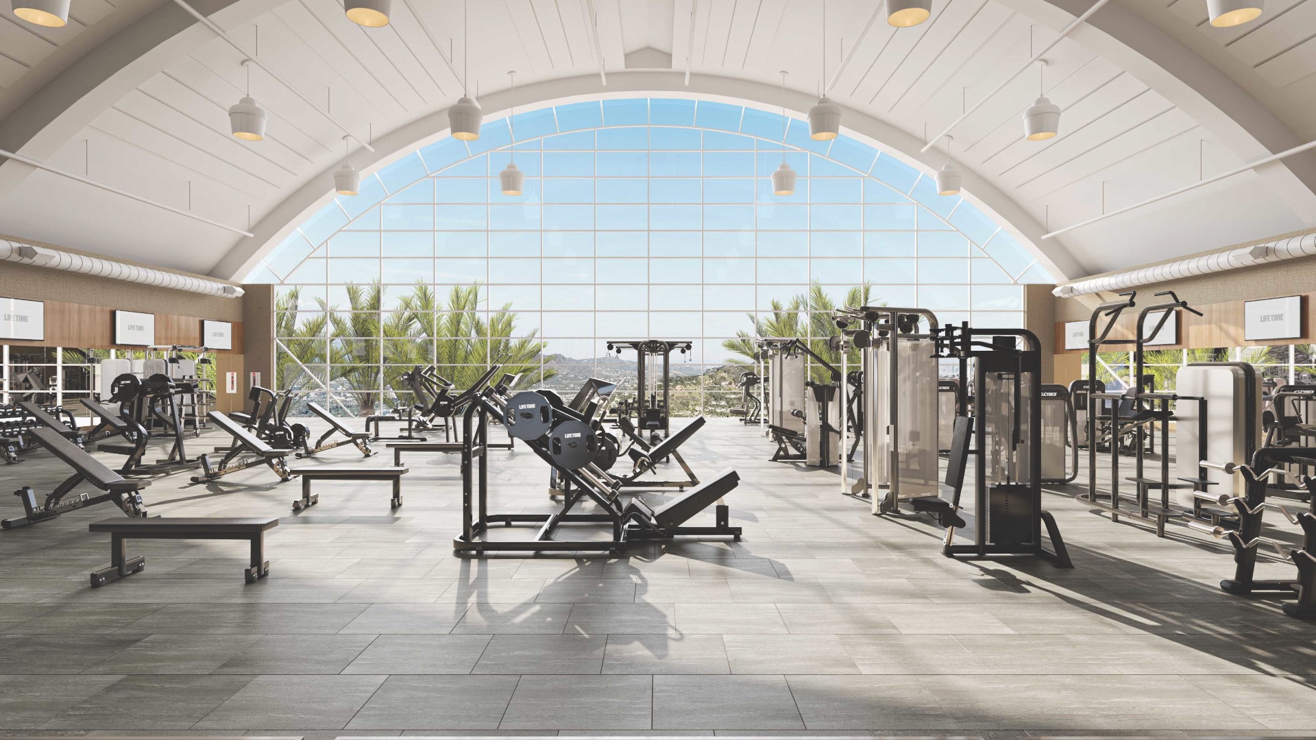 Strength training machines on the fitness floor at the Life Time Lakeshore club