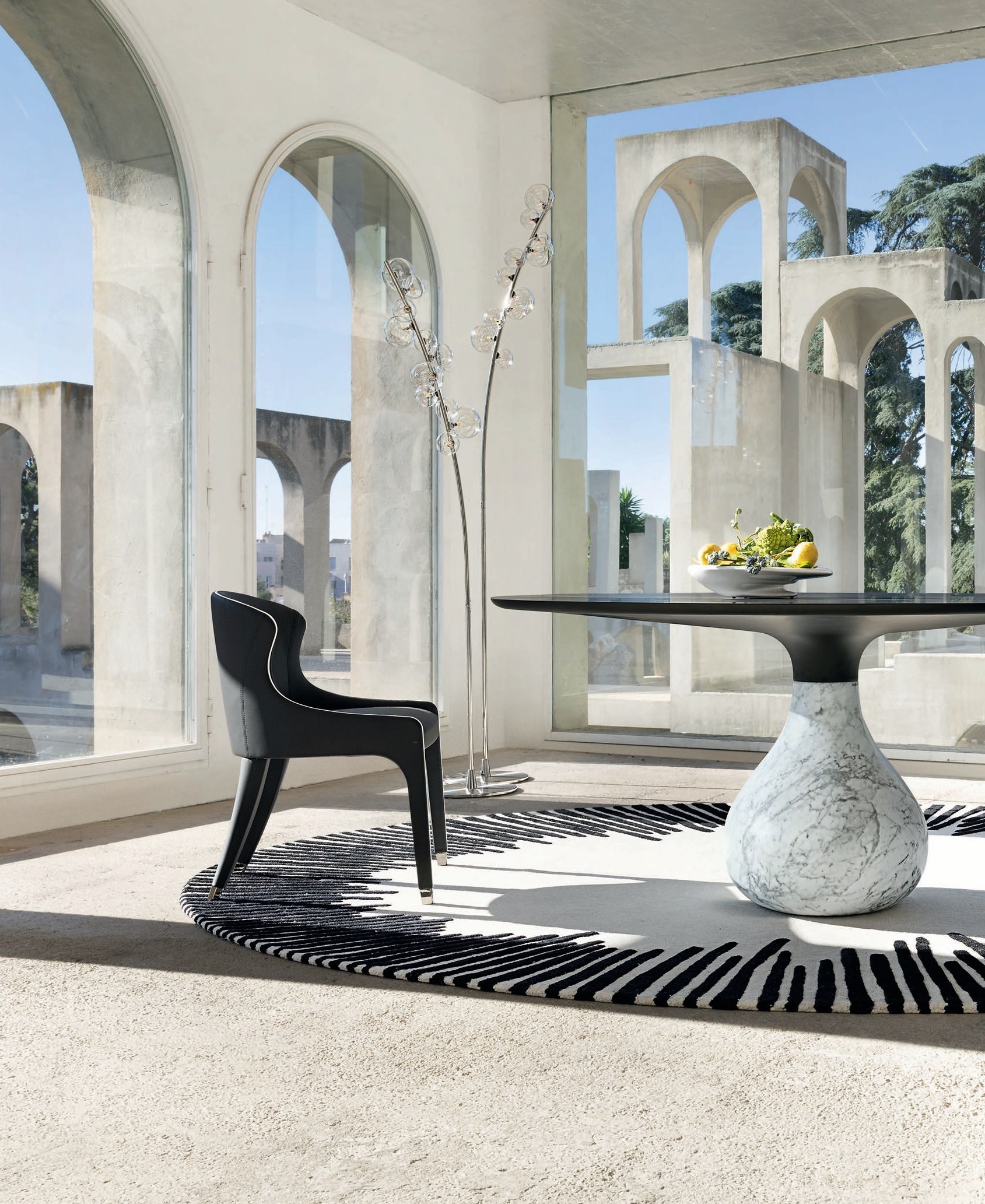 BEST CONTEMPORARY TABLE COLLECTION Roche Bobois Aqua collection With bases hewn from solid marble that mimic the moment a water droplet meets the earth, Aqua shows craftsmanship at its finest. Designed by Fabrice Berrux, each piece pairs that dynamic, fluid baseâavailable in multiple finishesâwith a refined matte or glossy top, creating a tension between solidity and movement that feels both sculptural and functional. roche-bobois.com