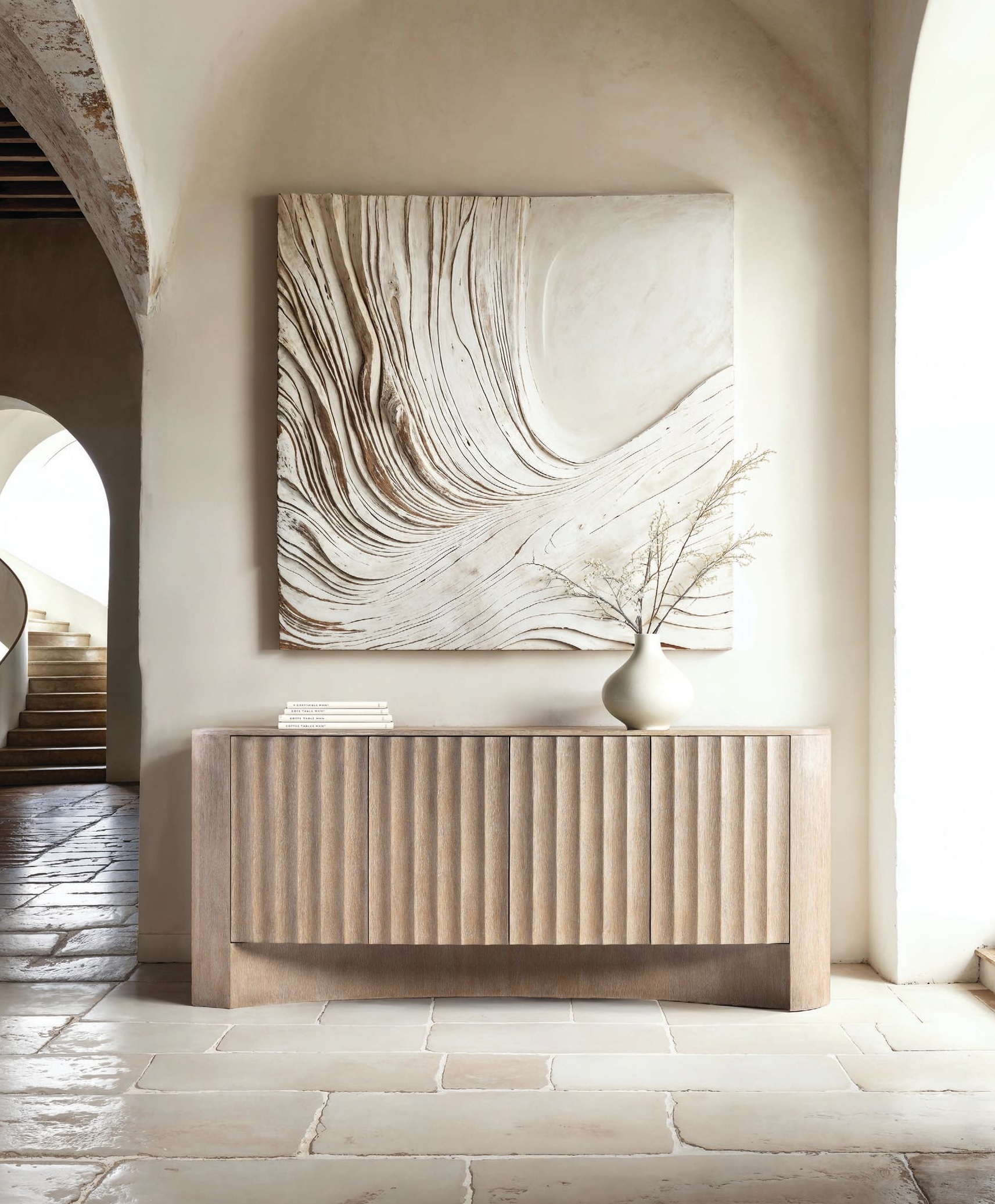 BEST CREDENZA Bernhardt Furniture Loggia Entertainment Credenza Loggia makes storage feel architectural, with modern fluting carved into three push-to-open doors and finished in a soft, neutral Aria tone. A concave base adds sculptural depth, while the interiorâadjustable shelving, a soft-close drawer, and thoughtful grommets and ventsâproves itâs designed for real living and media needs. Itâs function, elevated through impeccable proportion and detail. bernhardt.com