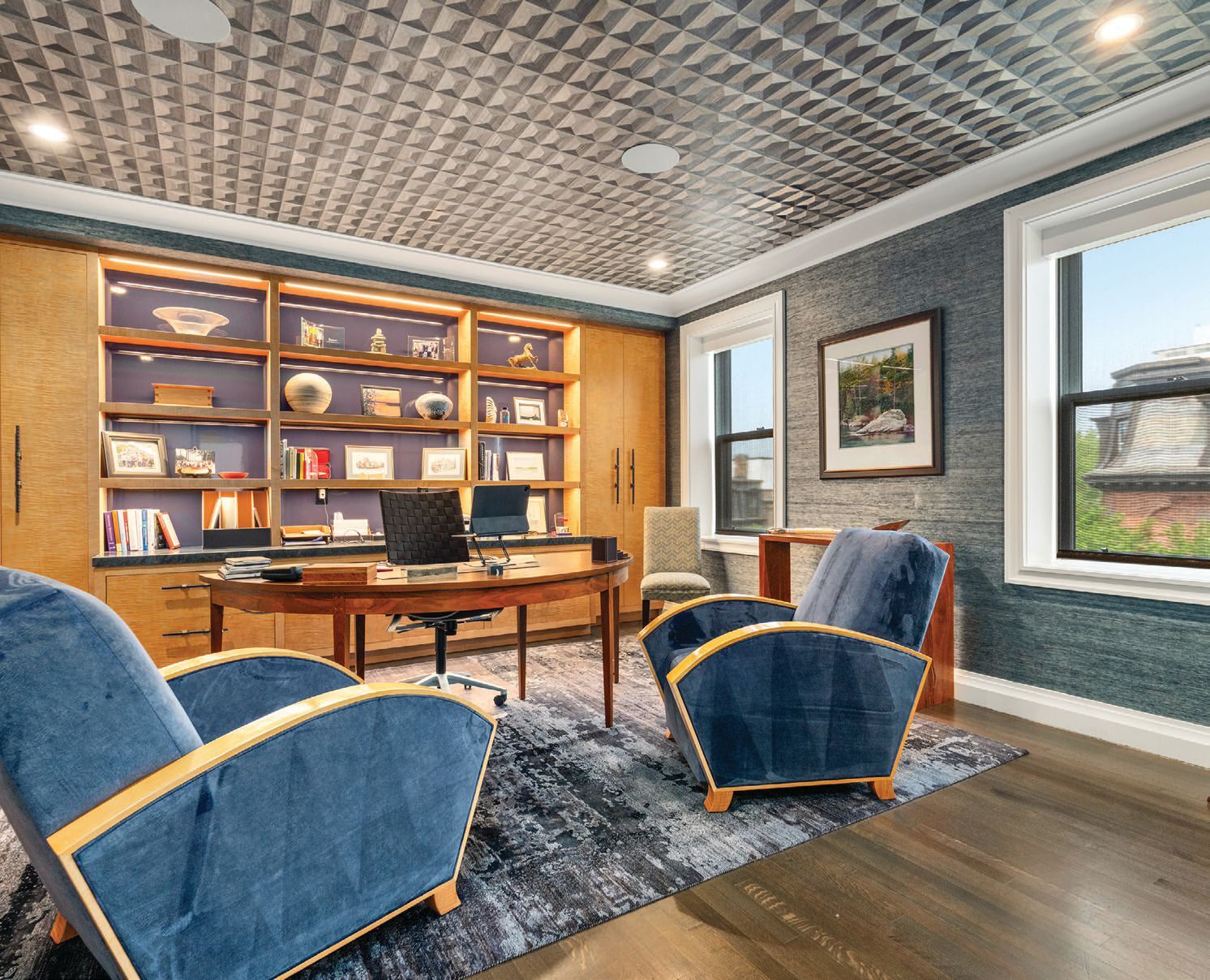 A stately office in the Back Bay penthouse with gorgeous city views out the residenceâs many windows PHOTO BY DRONE HOME MEDIA