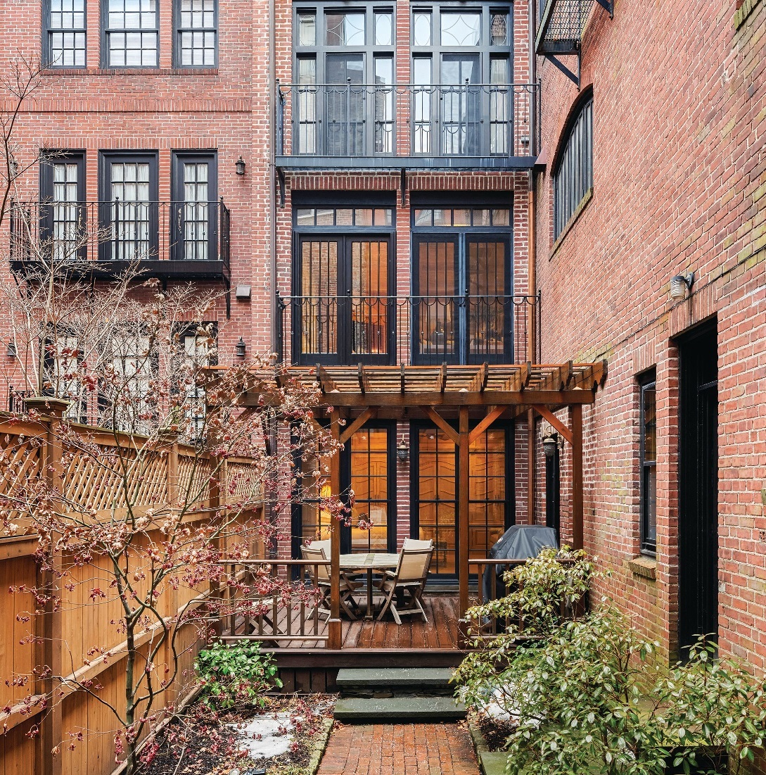 The private garden terrace at this two-level Beacon Hill home PHOTO BY JACK VATCHER