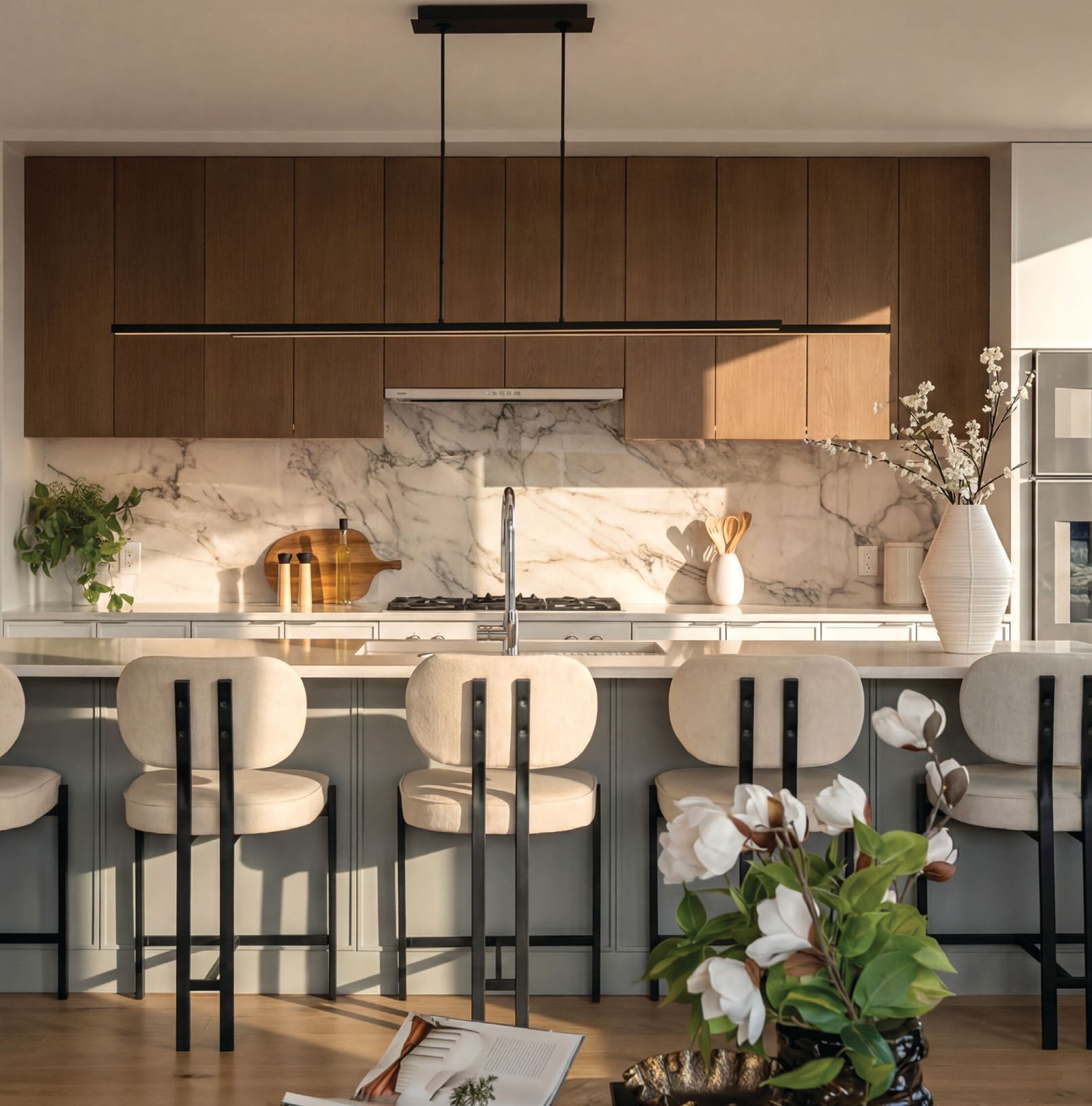 The bespoke three-tone kitchen in the South End penthouse PHOTO BY DRONE HOME MEDIA
