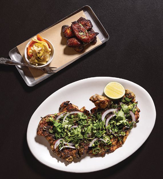 Condesaâs pollo asado with grilled half chicken, adobo verde, fried sweet plantains and escabeche. PHOTO: BY GAB BONGHI