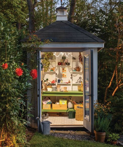 A beloved vegetable garden benefits from a gorgeous shed strategically tucked behind a boxwood hedge. PHOTO BY KATE WICHLINSKI