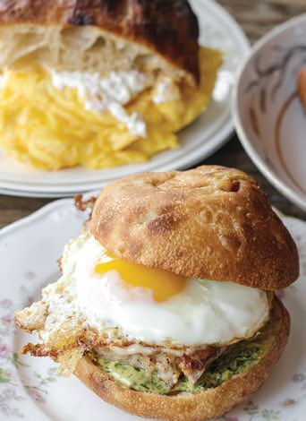 Fioreâs breakfast sandwich on schiacciate bread with herb aioli, fennel sausage and fontina cheese PHOTO: BY KARELIA FORLENZA