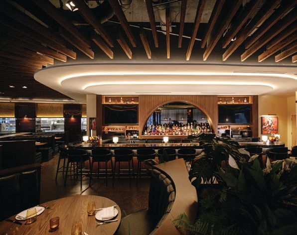 the warm, wood-fired dining room sets the tone. PHOTO BY LAURENT TOURENDEL