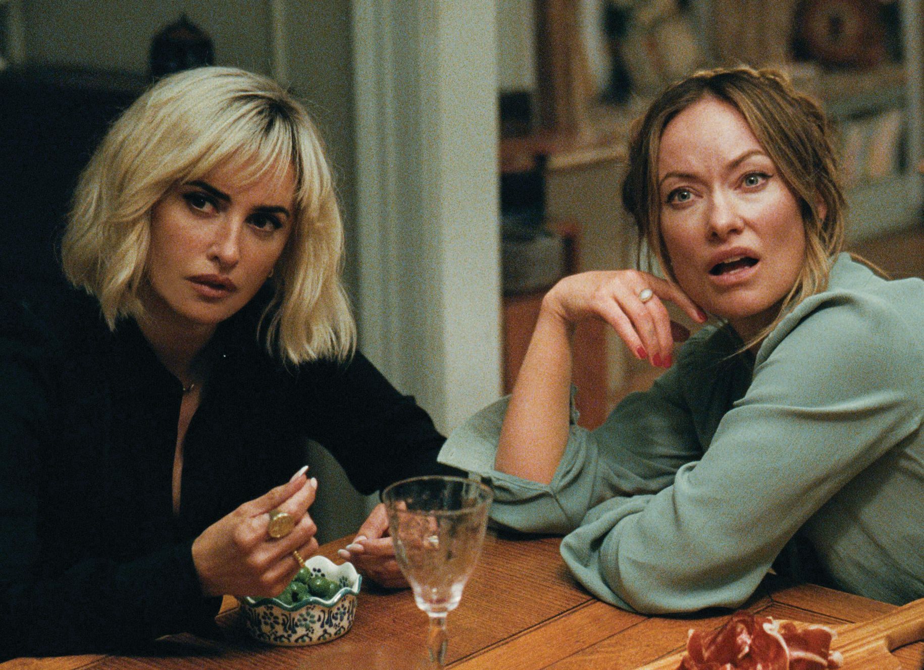 Penélope Cruz in The Invite, with co-star Olivia Wilde, who also directed the film. PHOTO COURTESY OF A24