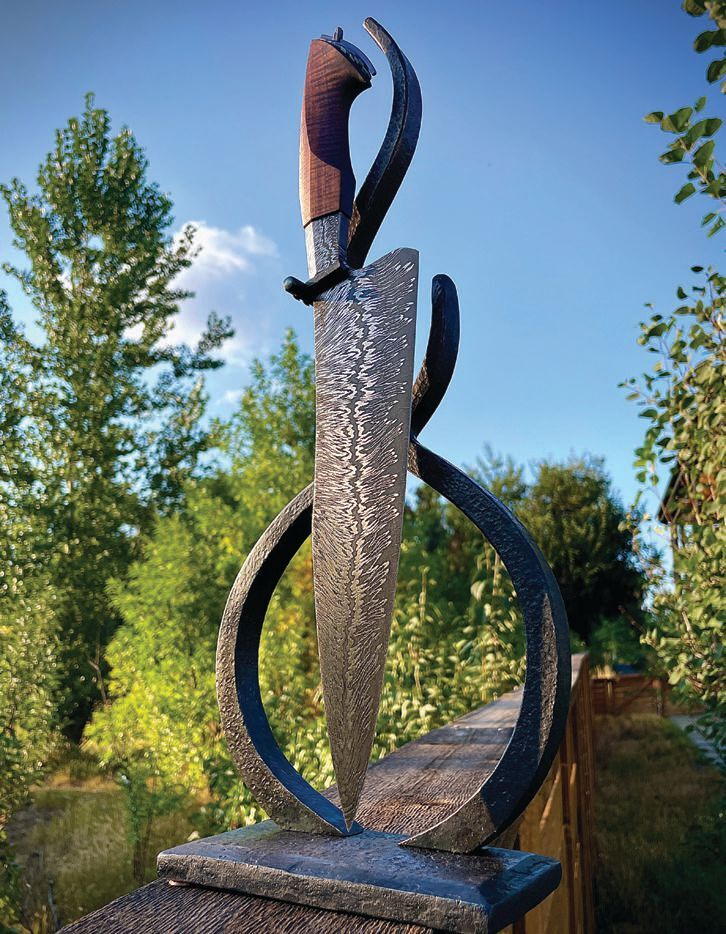 A work of art set on a forged steel stand, Simisky’s Fire Rising knife features an 11-inch Damascus steel blade with a “Richter” pattern inspired by seismic activity and a Hawaiian koa wood handle.