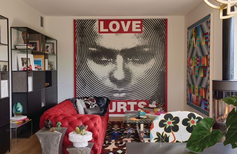 Barbara Kruger’s “Untitled (Love Hurts)” (2012) is the focal point of this space inside the Cookie Factory. At right, Jeffrey Gibson’s “Save Me” (2018).