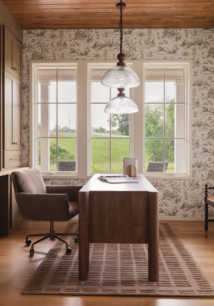 White oak ceilings run throughout the main level. The office features Toile wallpaper and sweeping views of the property photography by MARY CRAVEN DAWKINS stying by LEAH SELVIG ROBINSON