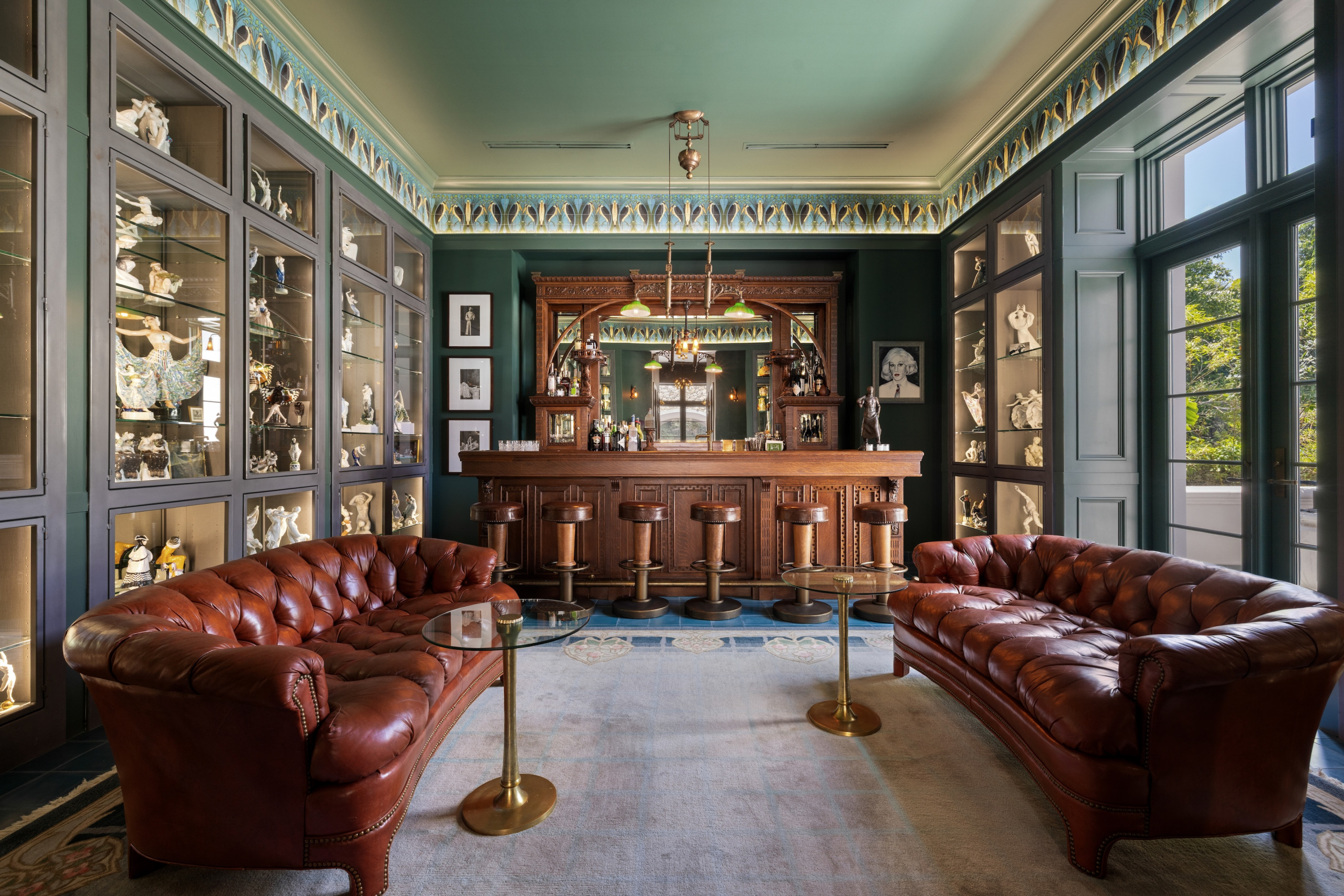 Elegant interior featuring a wooden bar and leather sofas