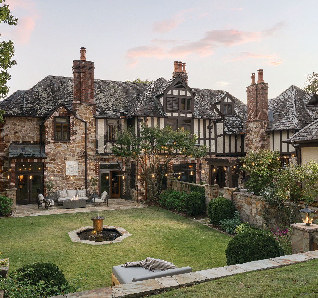 Stein repainted the exterior and reconfigured the outdoor furniture, adding a custom daybed to the existing pieces. Built in the 1920s, the English Tudor classical style inspired the redesign and paint choices for the interiors. photography by Tori Sikkema styling by Mark Thompson