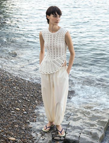 A white set on a woman by the water