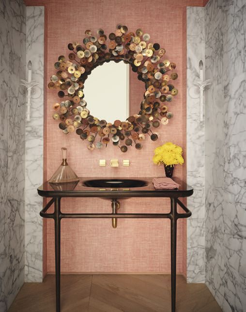 In the powder room, Christopher Farr Clothâs Bulu grasscloth in fuchsia adds a warm pink glow. PHOTO BY HOPE ROLLINS