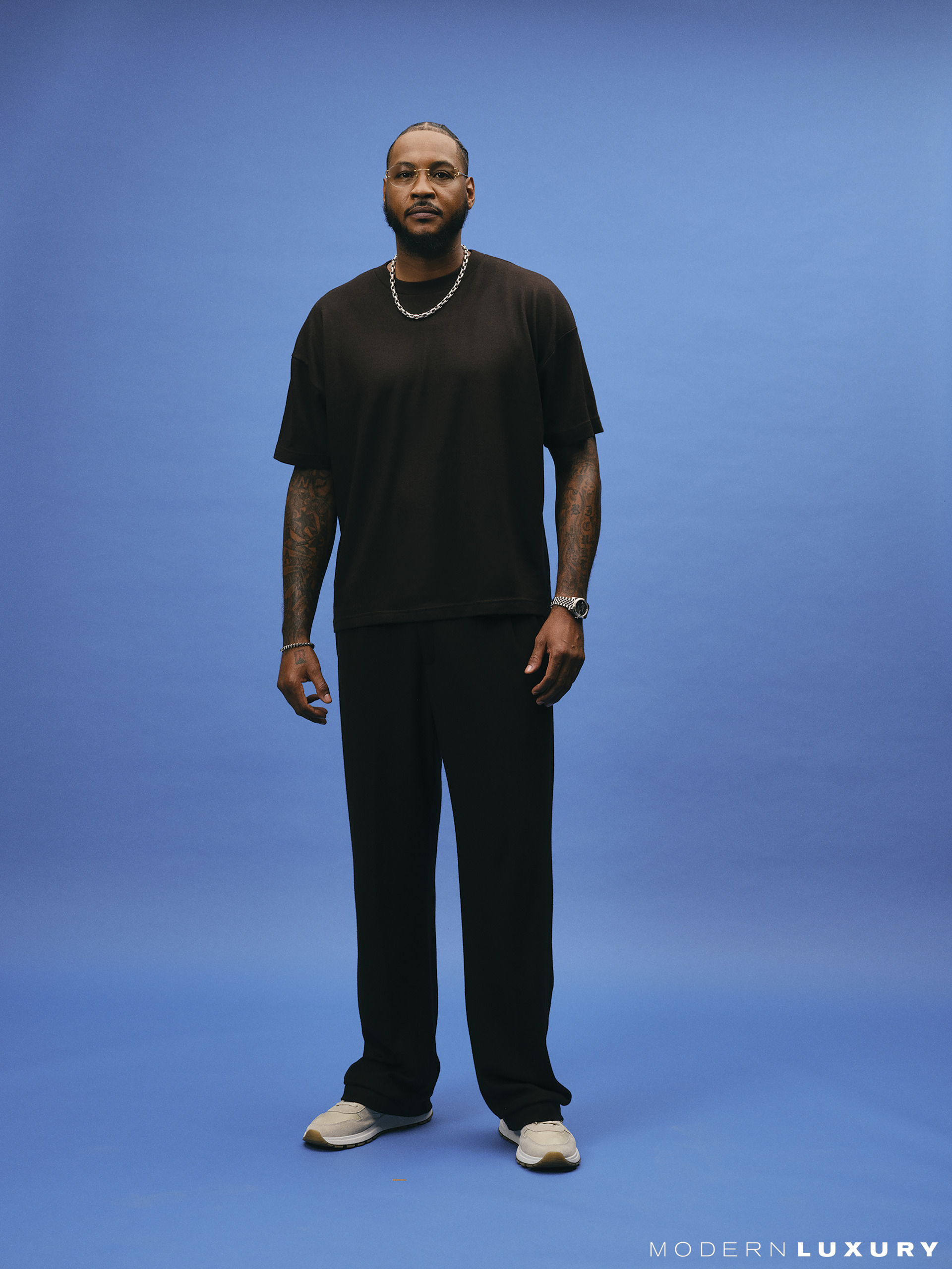 Custom STAYME7O look; Rolex Cosmograph Daytona; David Yurman Chevron oval link necklace in sterling silver and Armory link bracelet in sterling silver with black diamonds; Anthony’s own shoes and glasses.